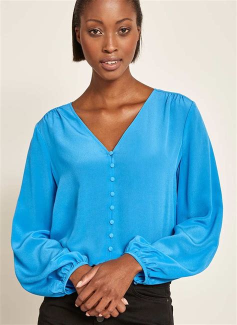 bright blue silk blouse.